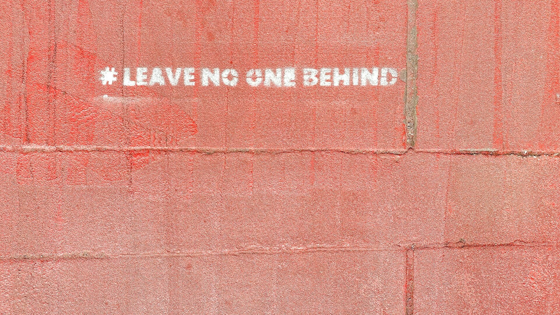 a red wall with a white sticker on it